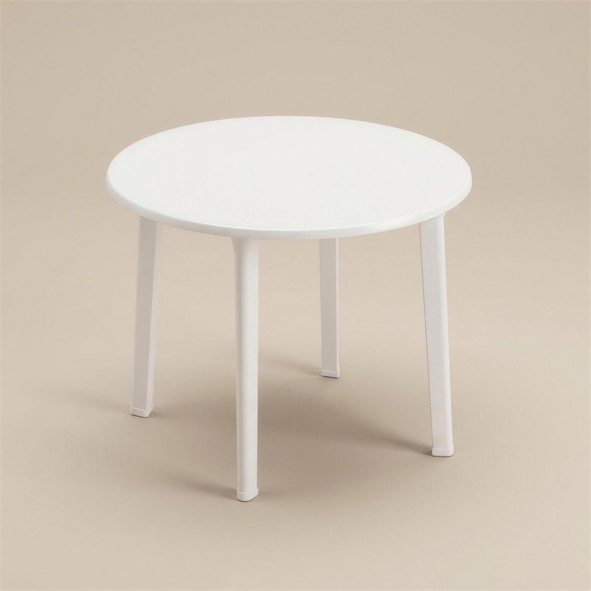 Mesa de exterior Selva redonda de 70 cm en resina blanca con cuatro patas, sobre fondo neutro